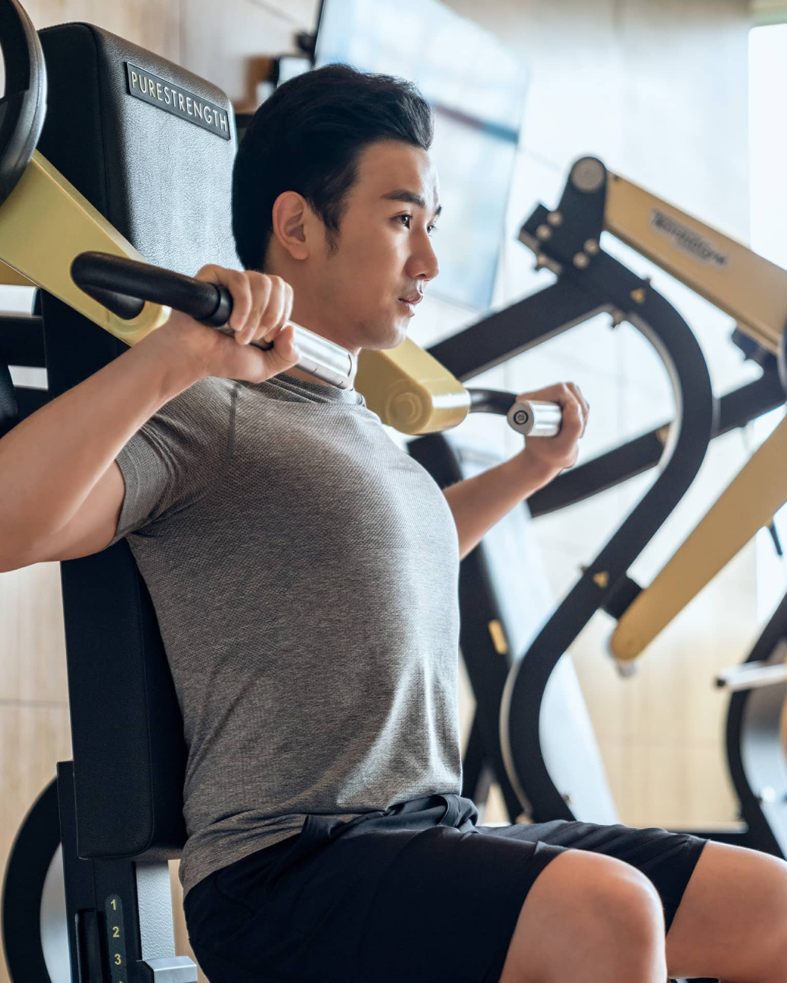 Guest using fitness equipment in gym at Four Seasons