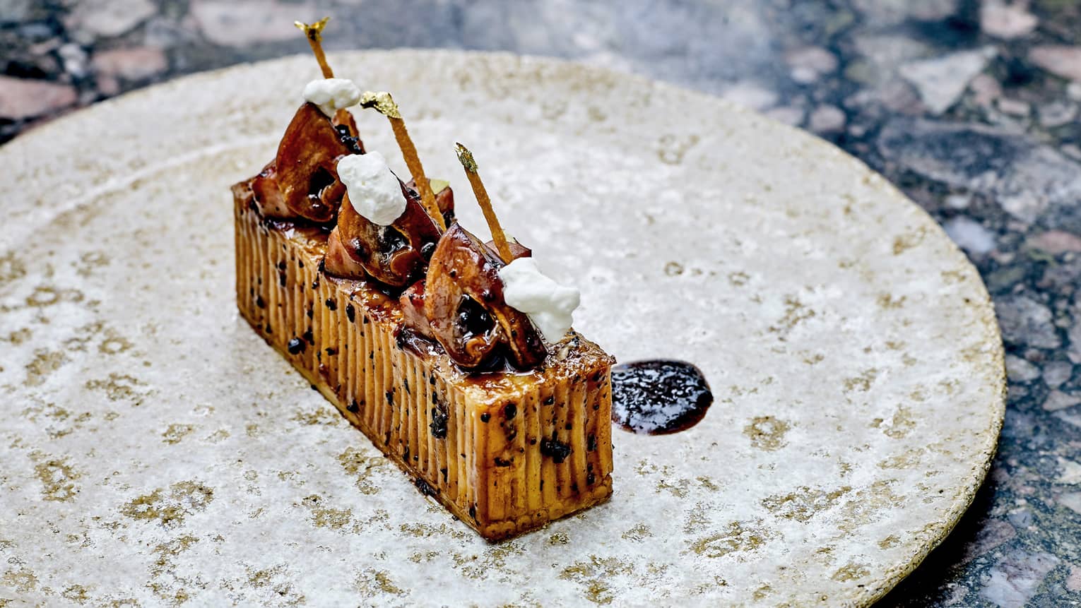 Contemporary plated food of truffle spaghetti gratin
