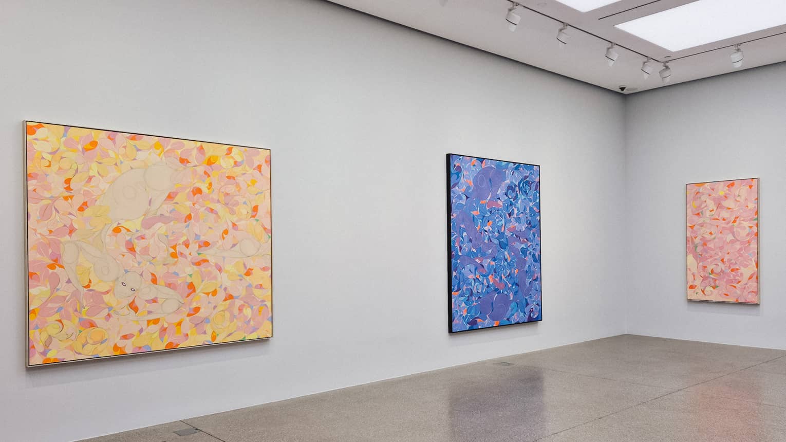 Colourful paintings in an art gallery room