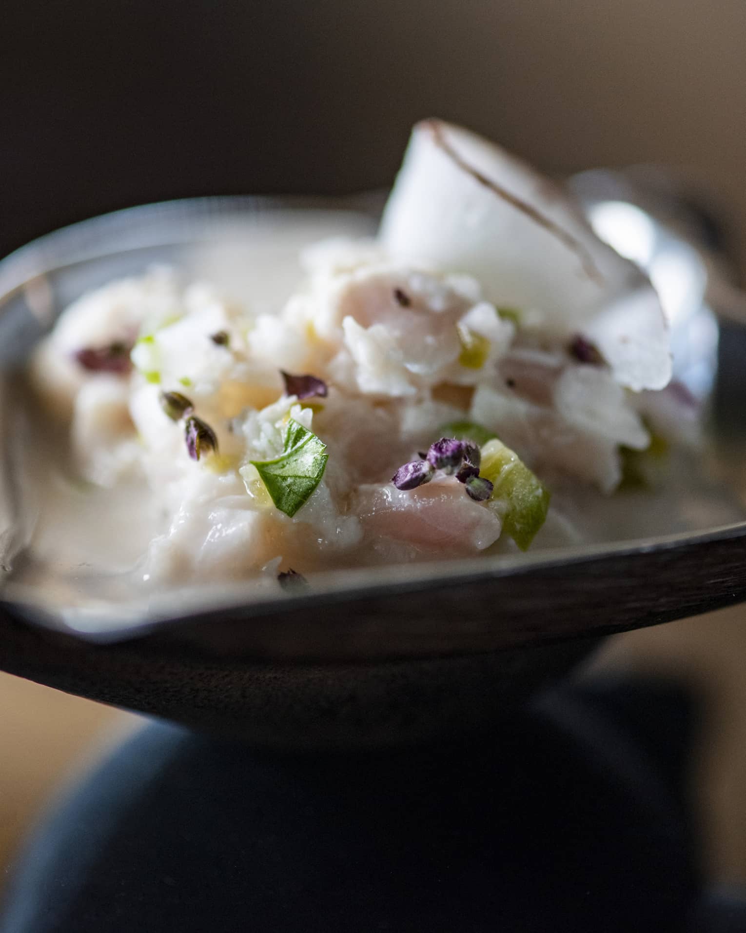 Raw fish in a small bowl.