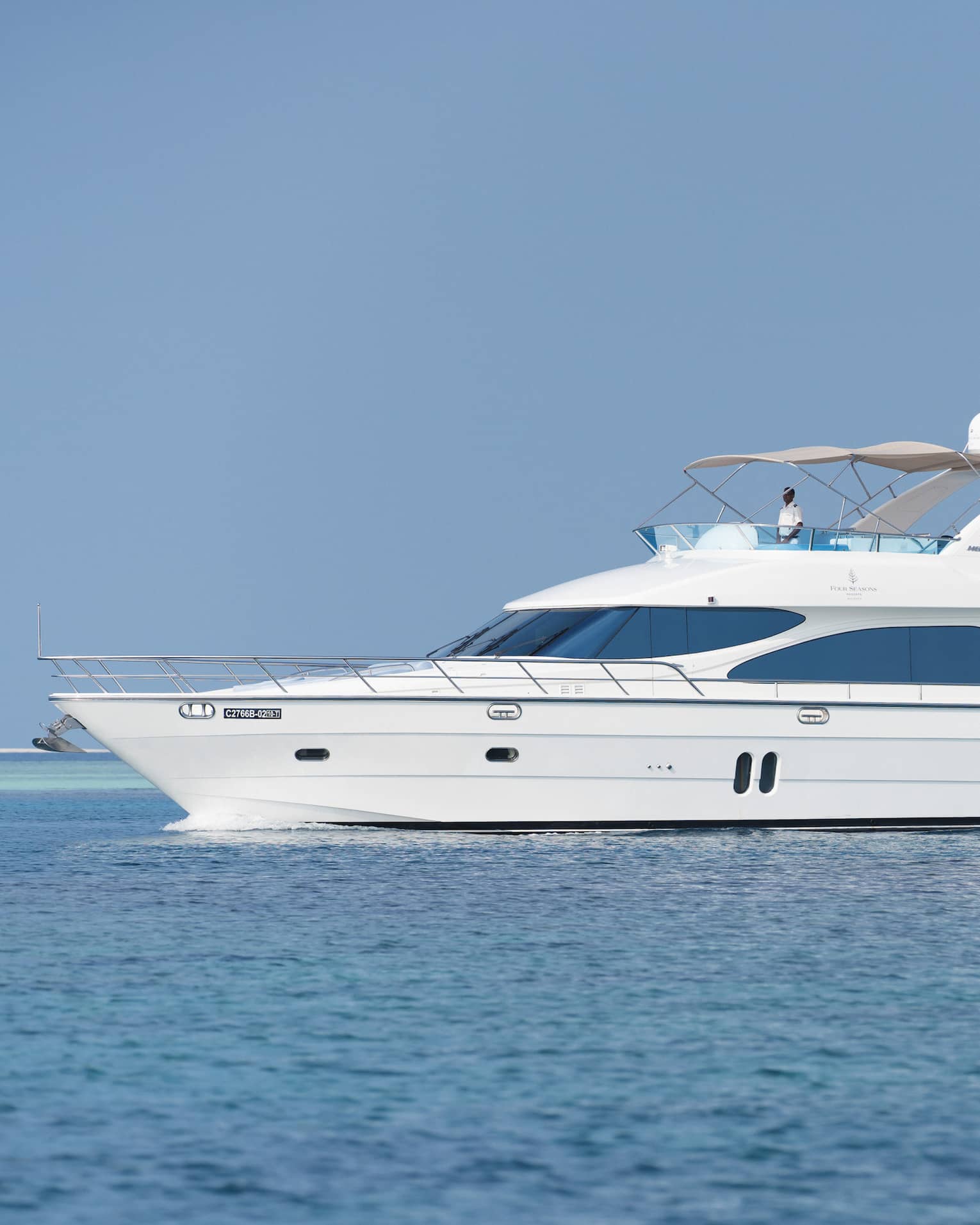 Small white private luxury yacht sailing on ocean