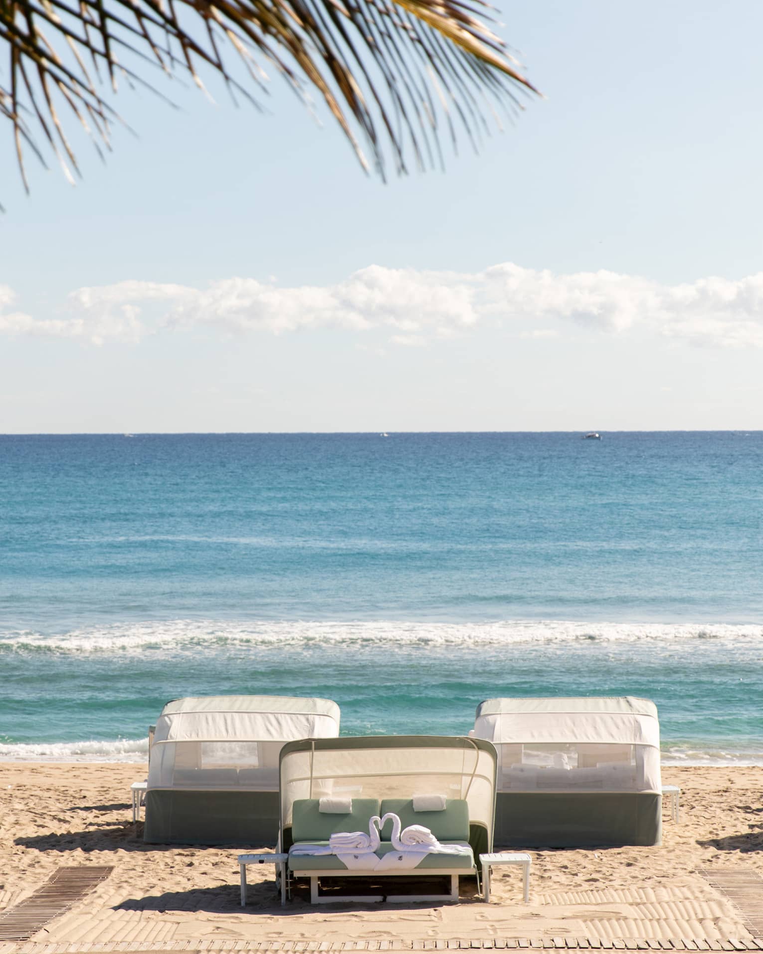 Five beachfront cabanas look out onto the ocean
