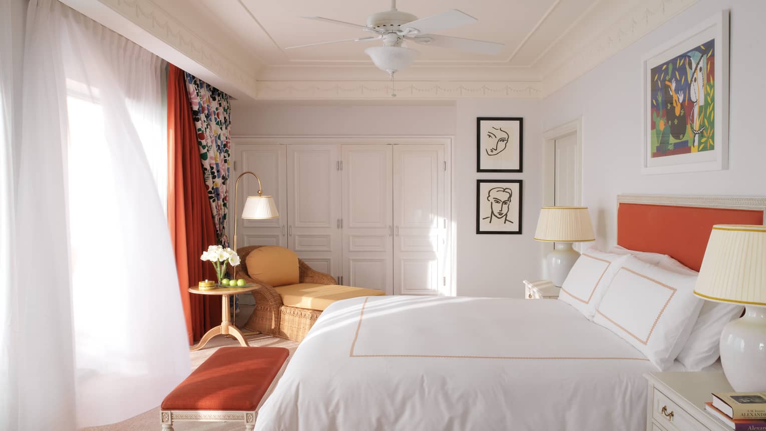 Bright Pool Terrace Room with white walls, bed linens, curtains, orange accent colours