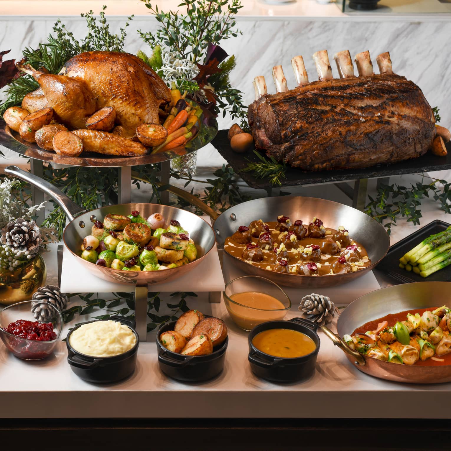 Thanksgiving dinner spread including turkey, prime rib and traditional side dishes