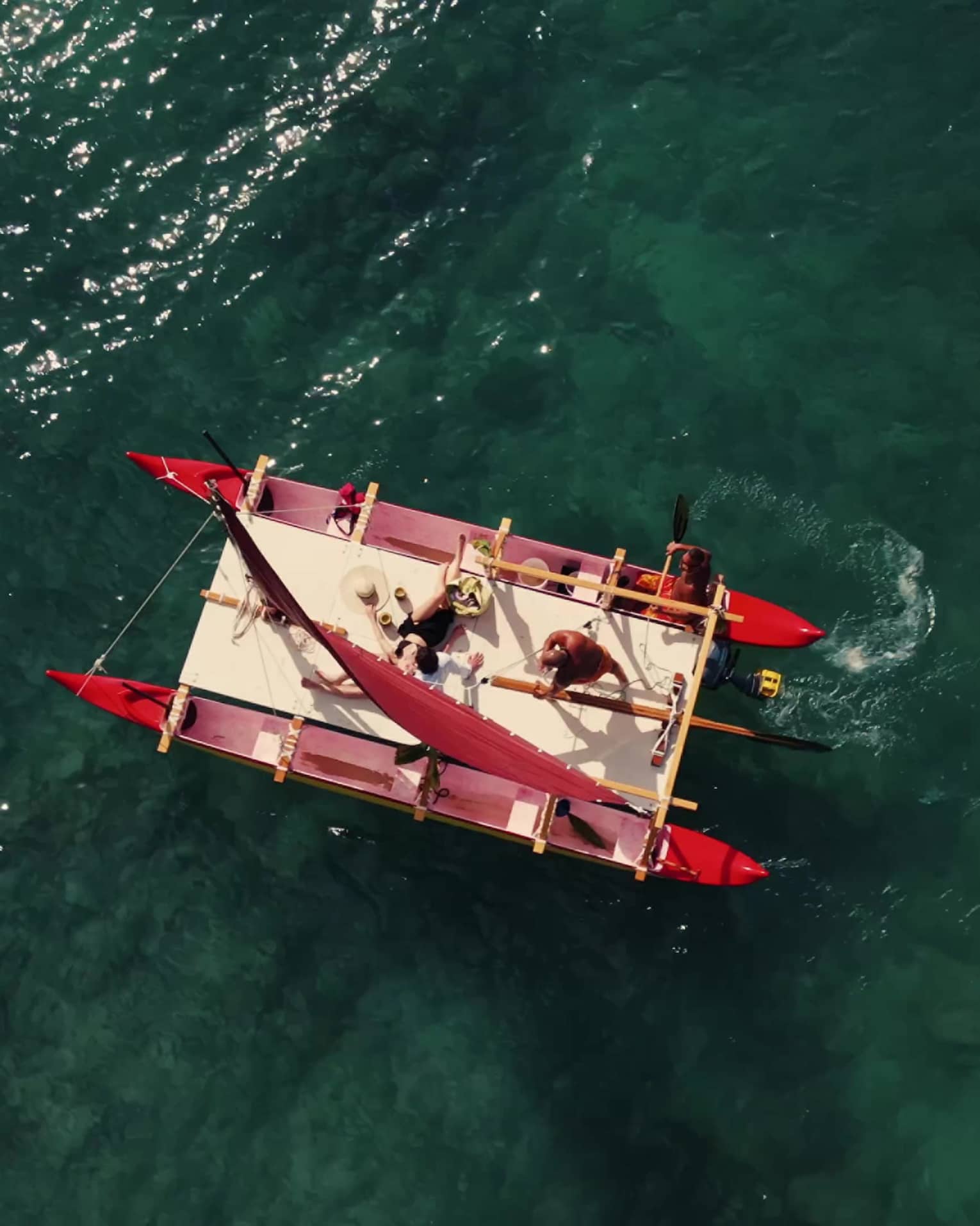 Aerial view of a Hawaiian double hull canoe on the water