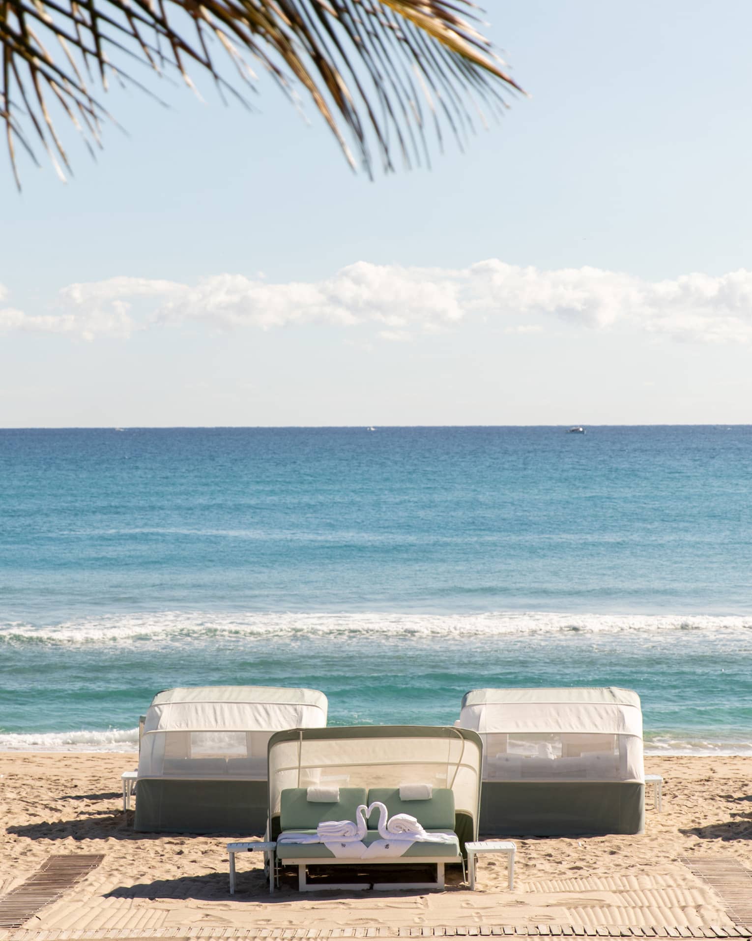 Five beachfront cabanas look out onto the ocean