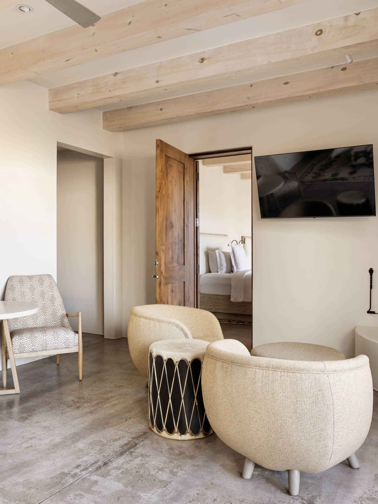 Sitting area with TV and connecting room at Four Seasons Resort Santa Fe