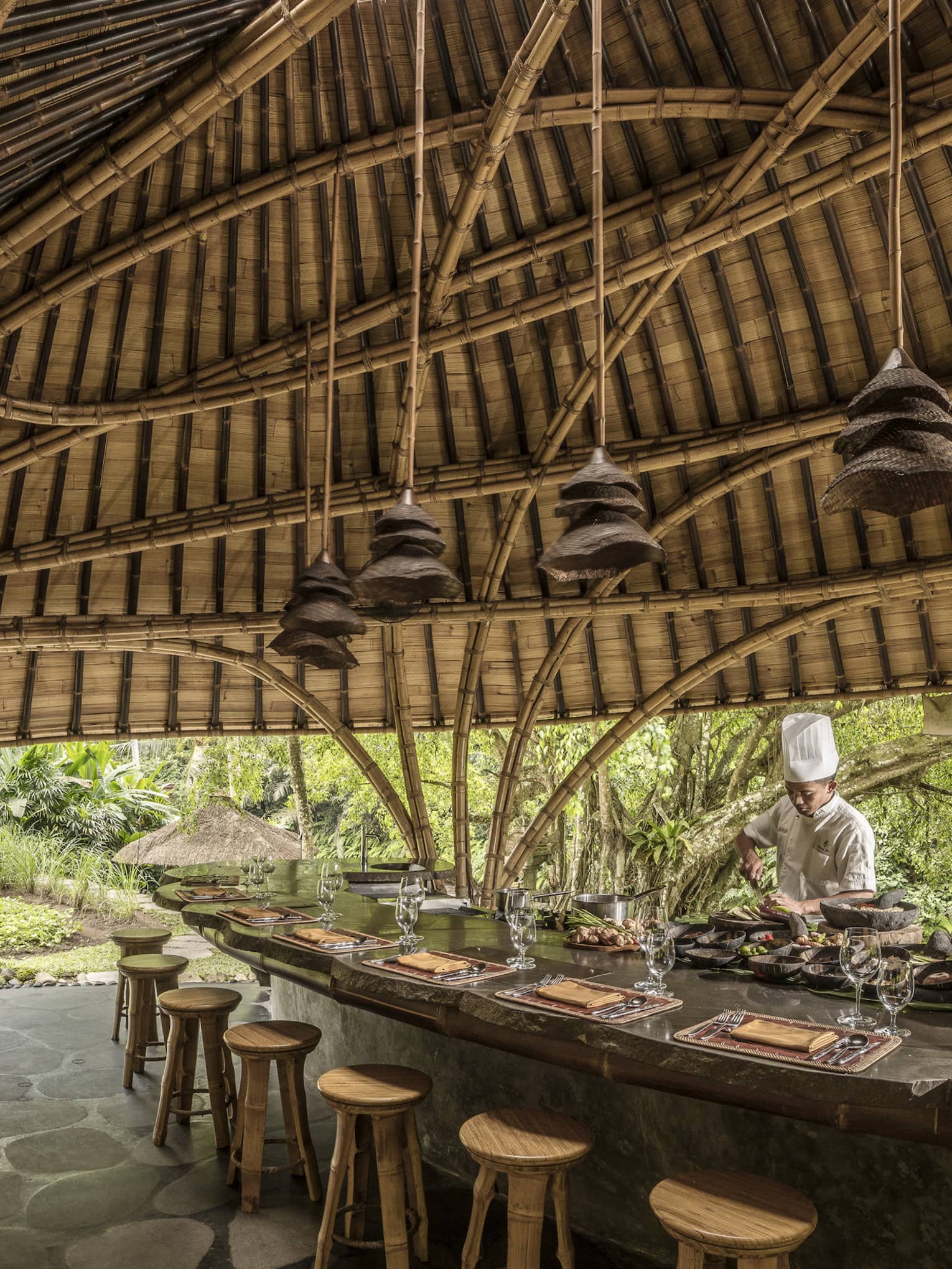 A chef prepares for Sokasi Cooking School in a bamboo pavillion