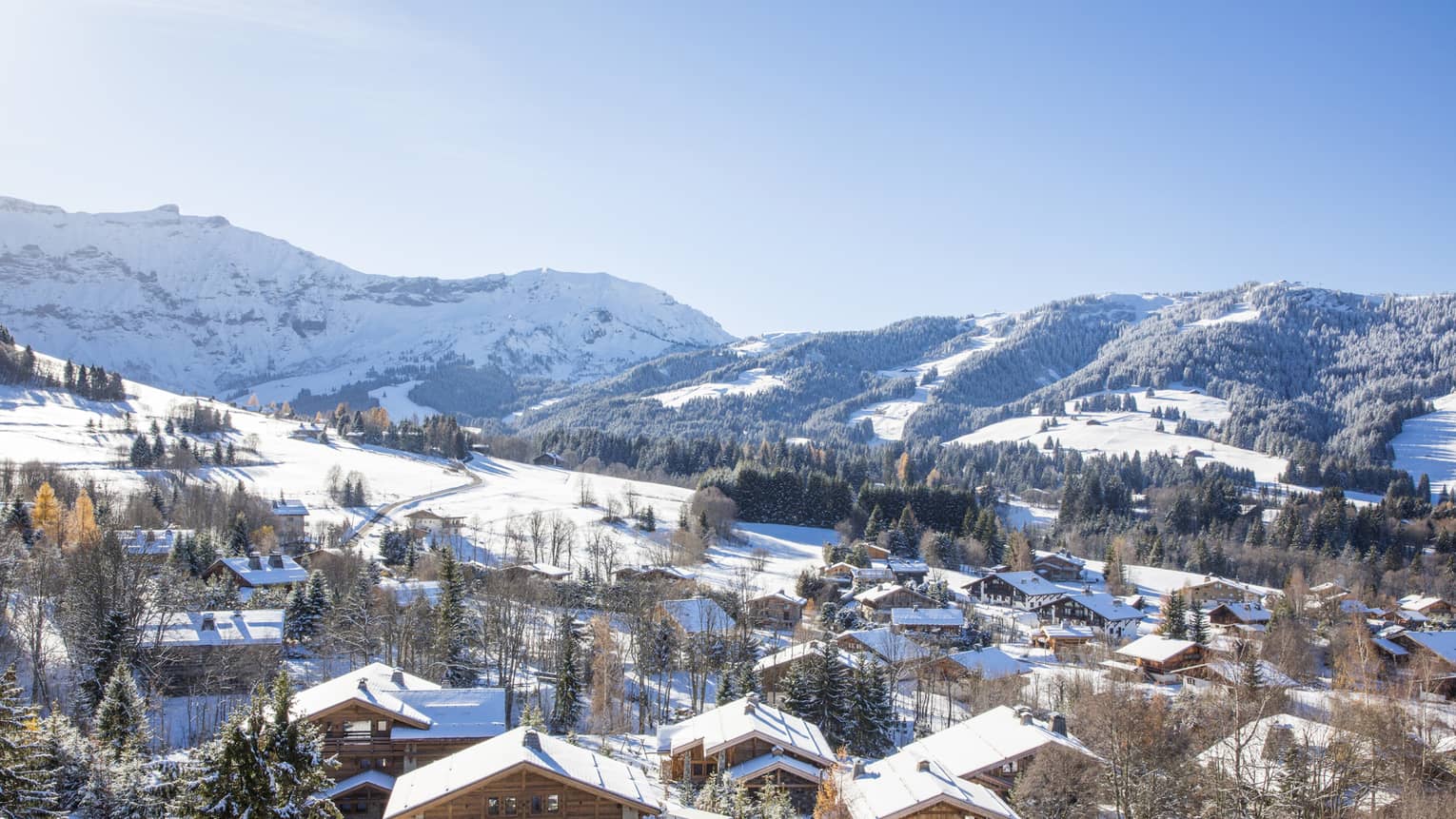 View over Megève Village chalets, snowy rooftops on mountain