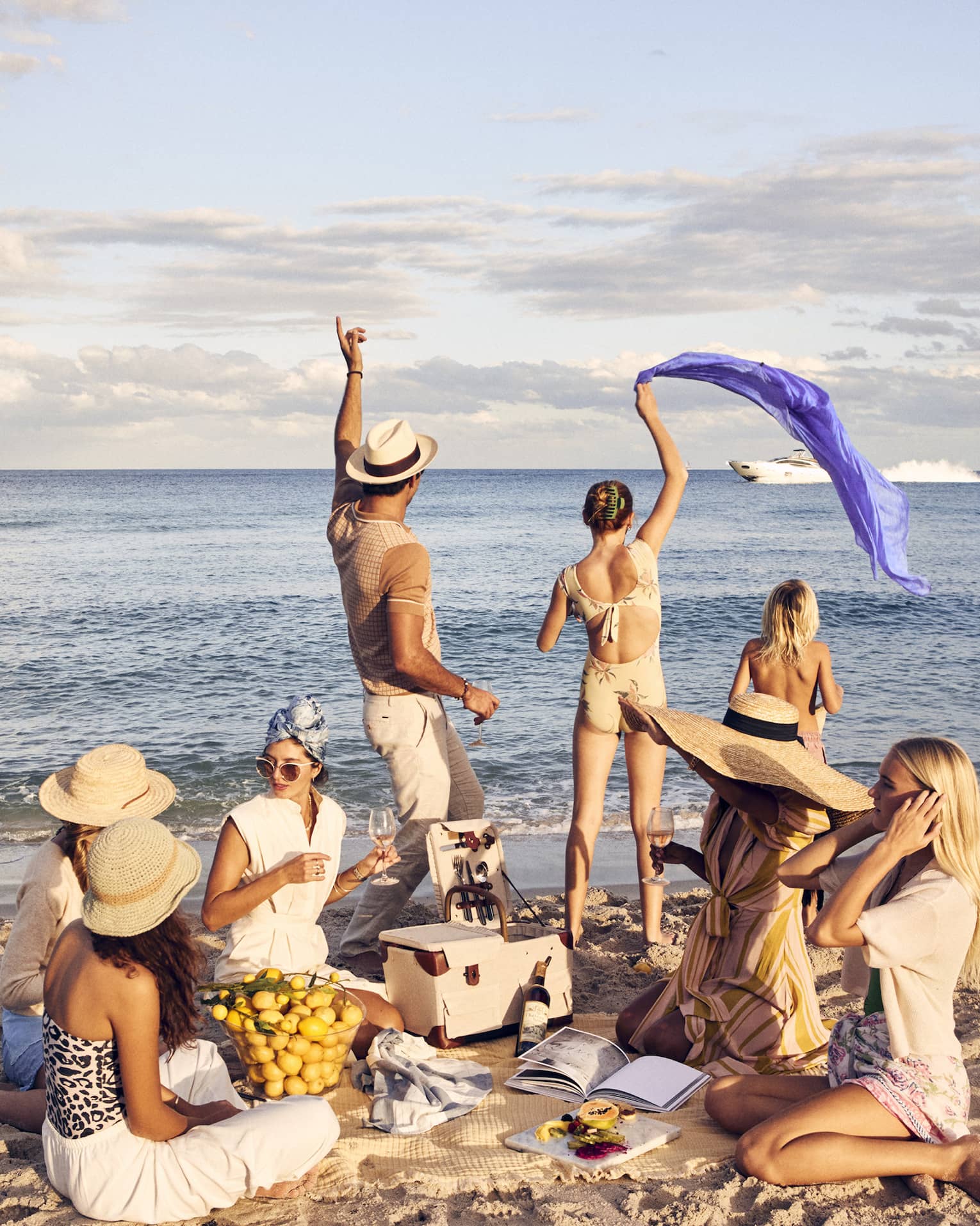 A group of people having a picnic on a beach.