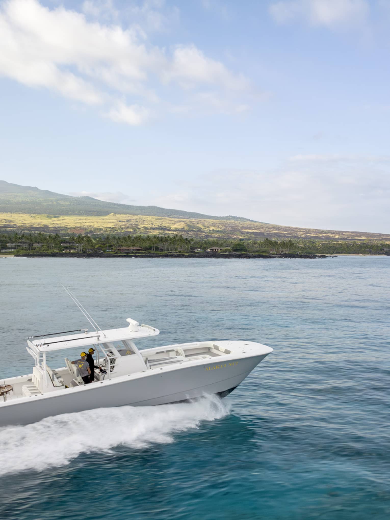 Boat on the water along Hawaii Island coast