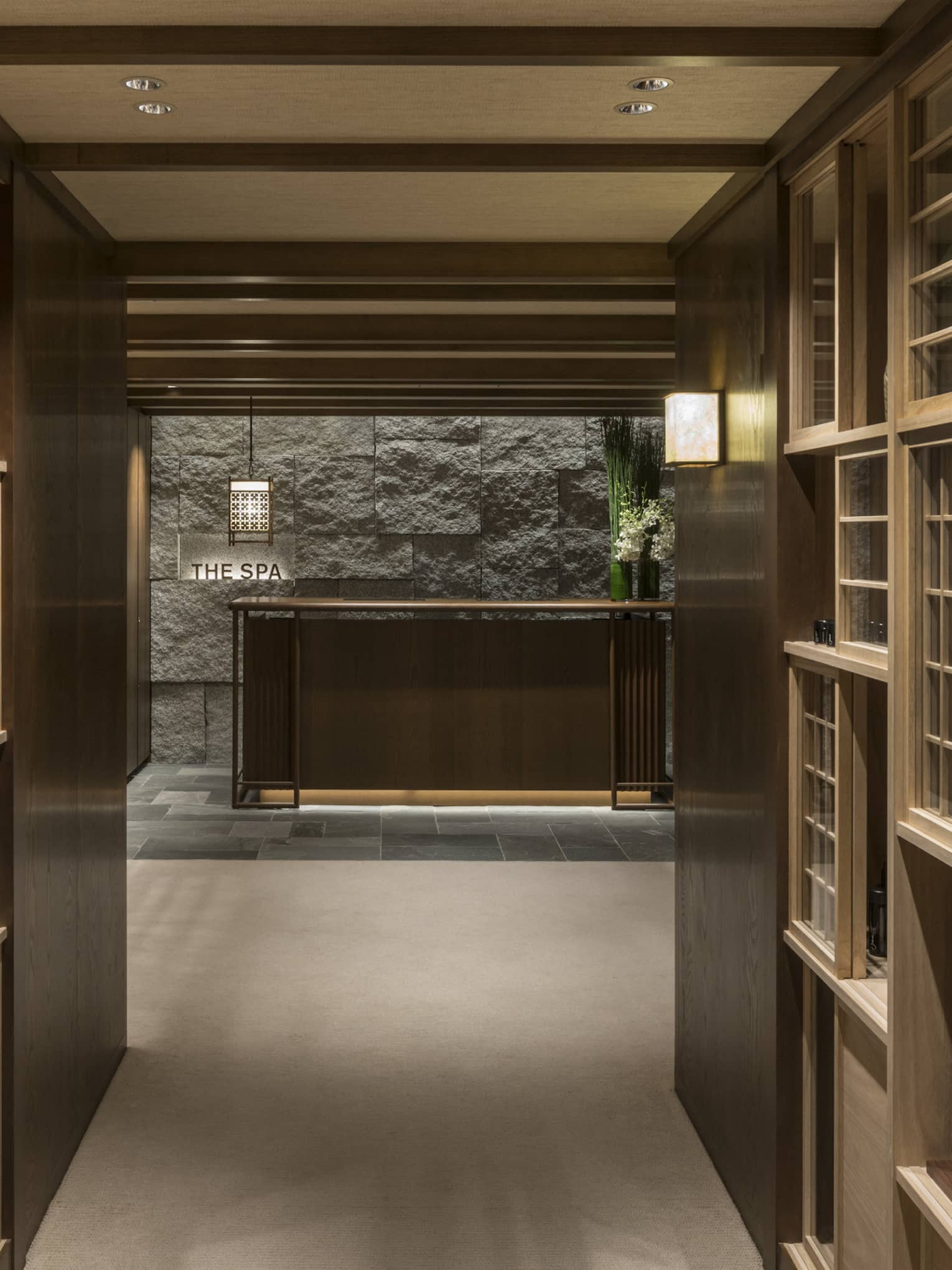 Tranquil entryway to the Kyoto hotel spa at Four Seasons Hotel Kyoto with refined wooden interiors and calm ambiance.