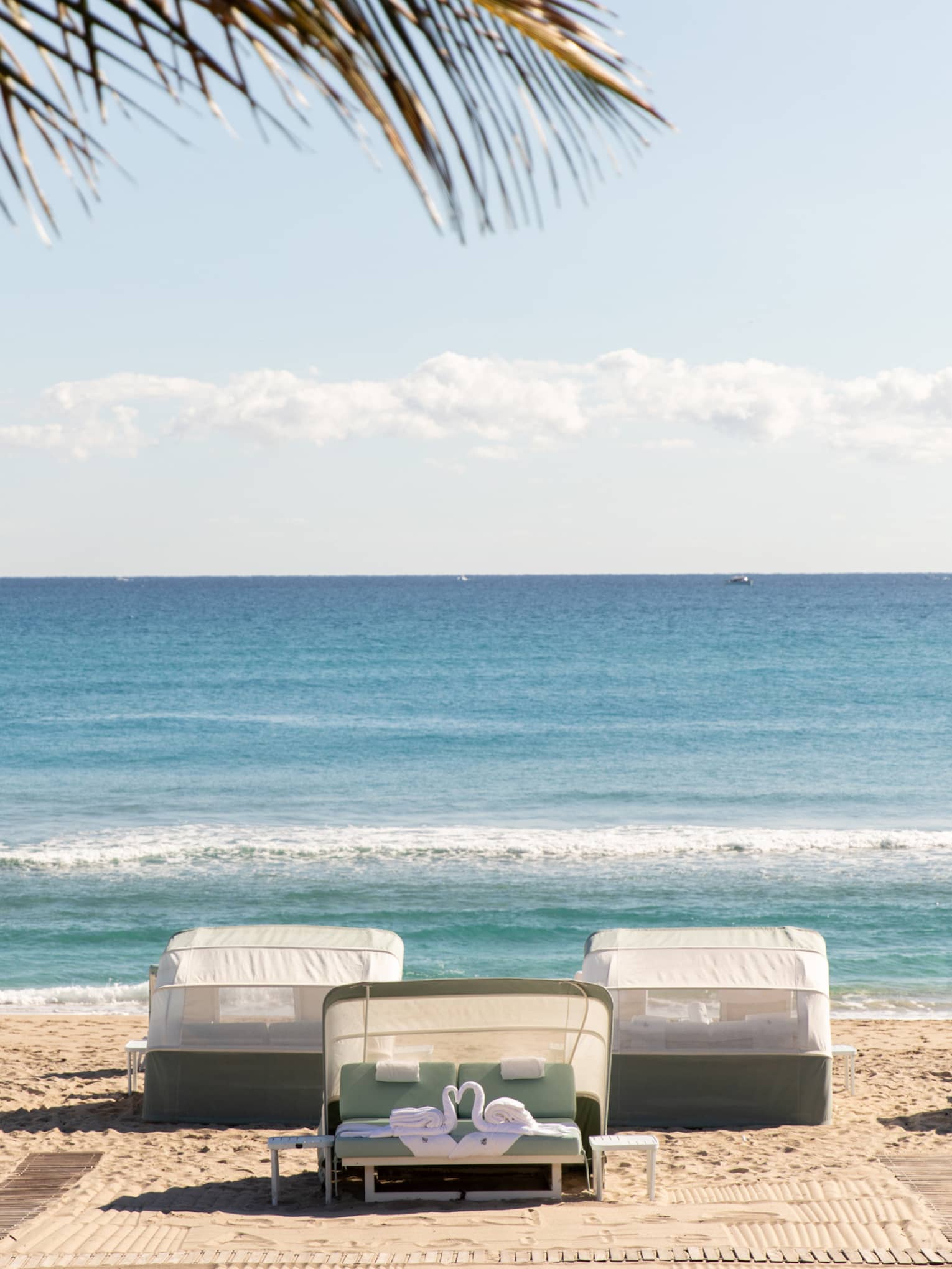 Five beachfront cabanas look out onto the ocean