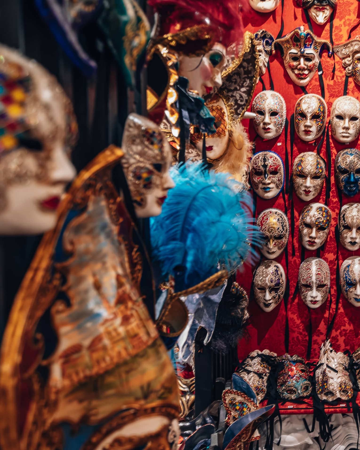 Venetian masks displayed on a wall