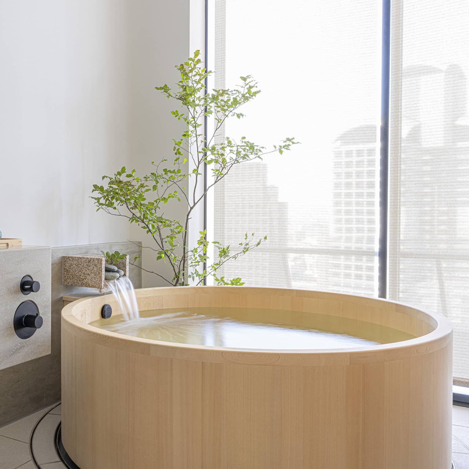 Private tub in spa treatment room at The Spa at Four Seasons Hotel Osaka