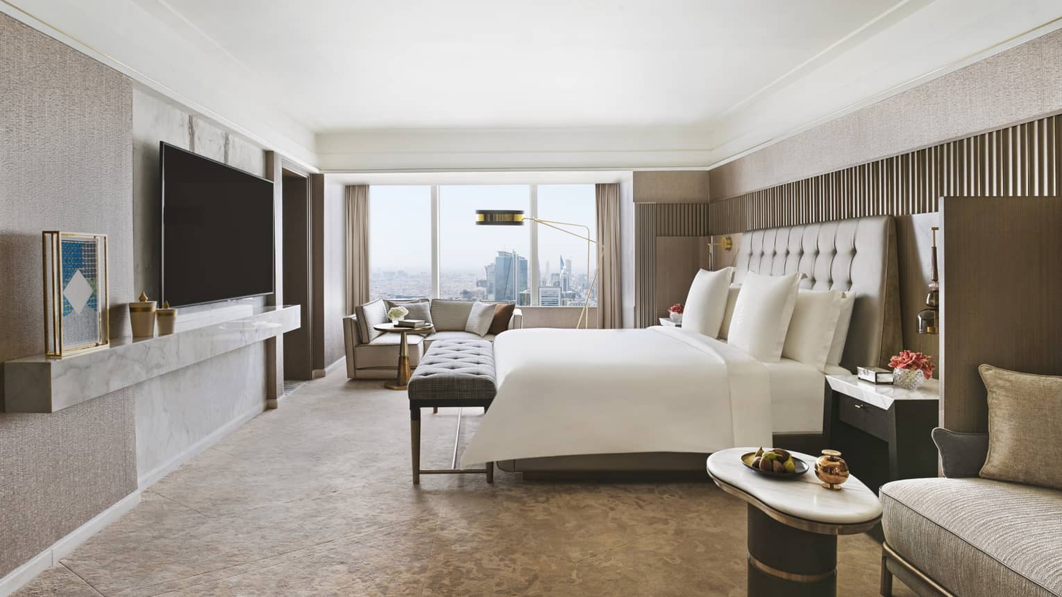 Bedroom with king bed, TV and sitting area