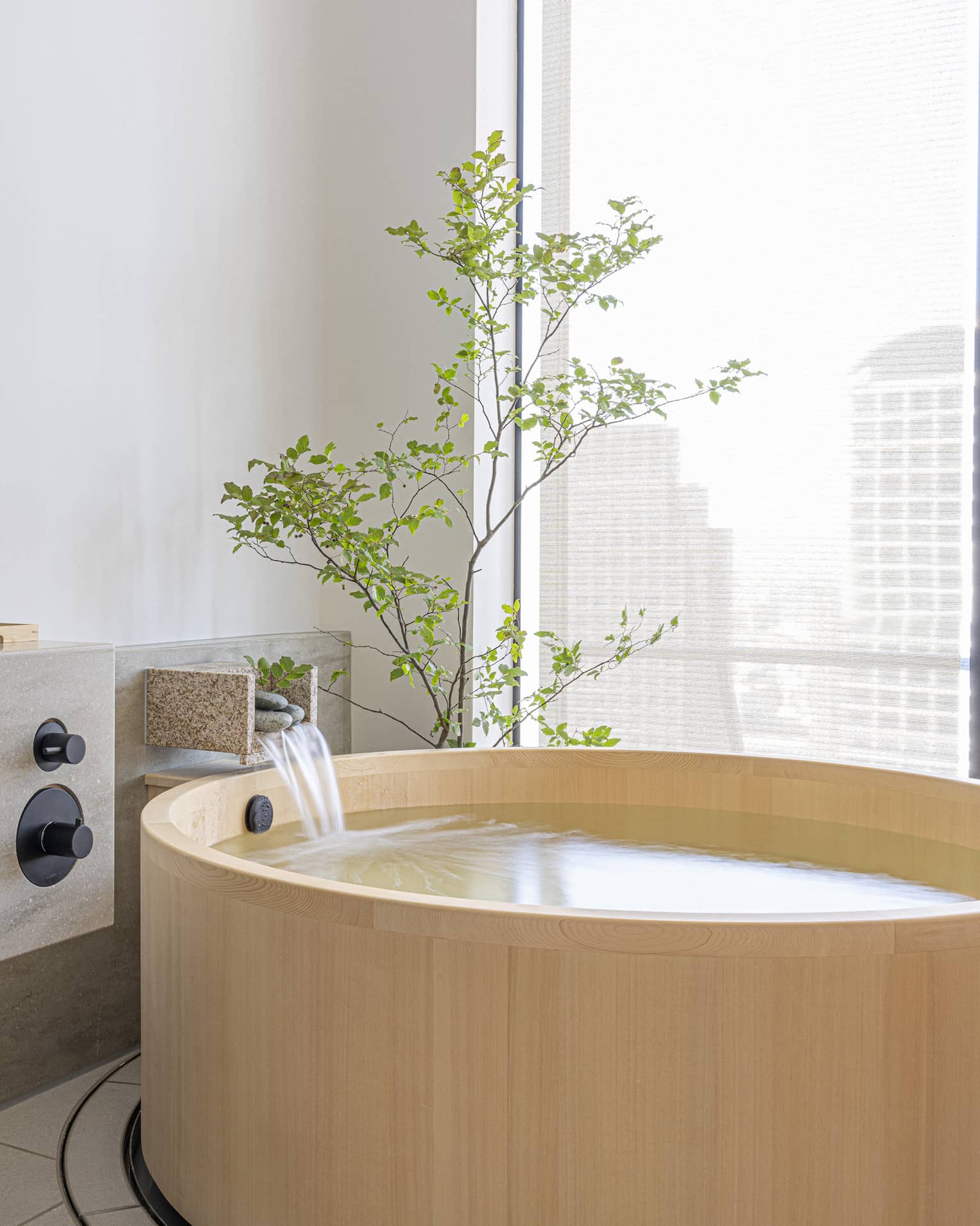 Private tub in spa treatment room at The Spa at Four Seasons Hotel Osaka