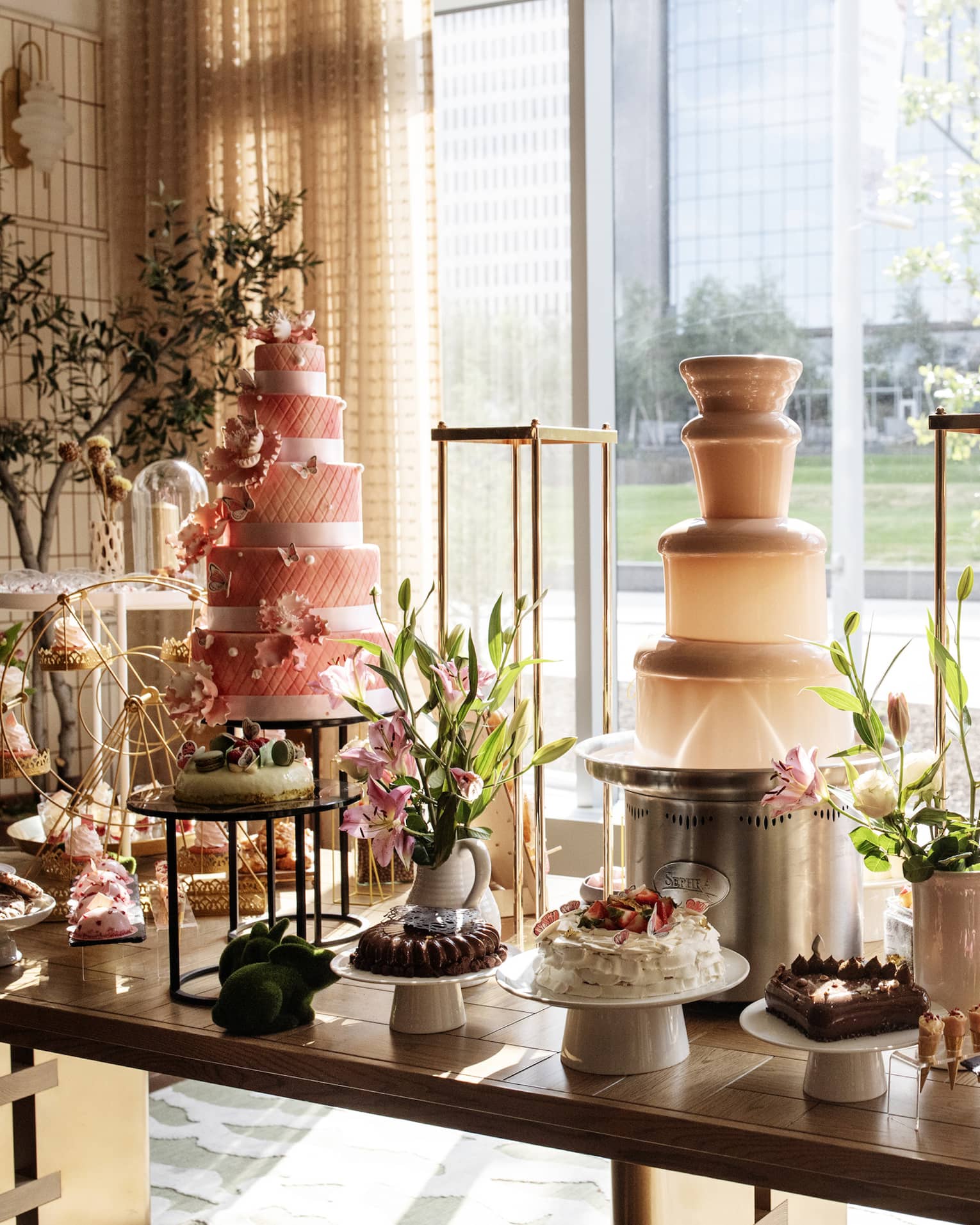A buffet with displays of desserts and cakes