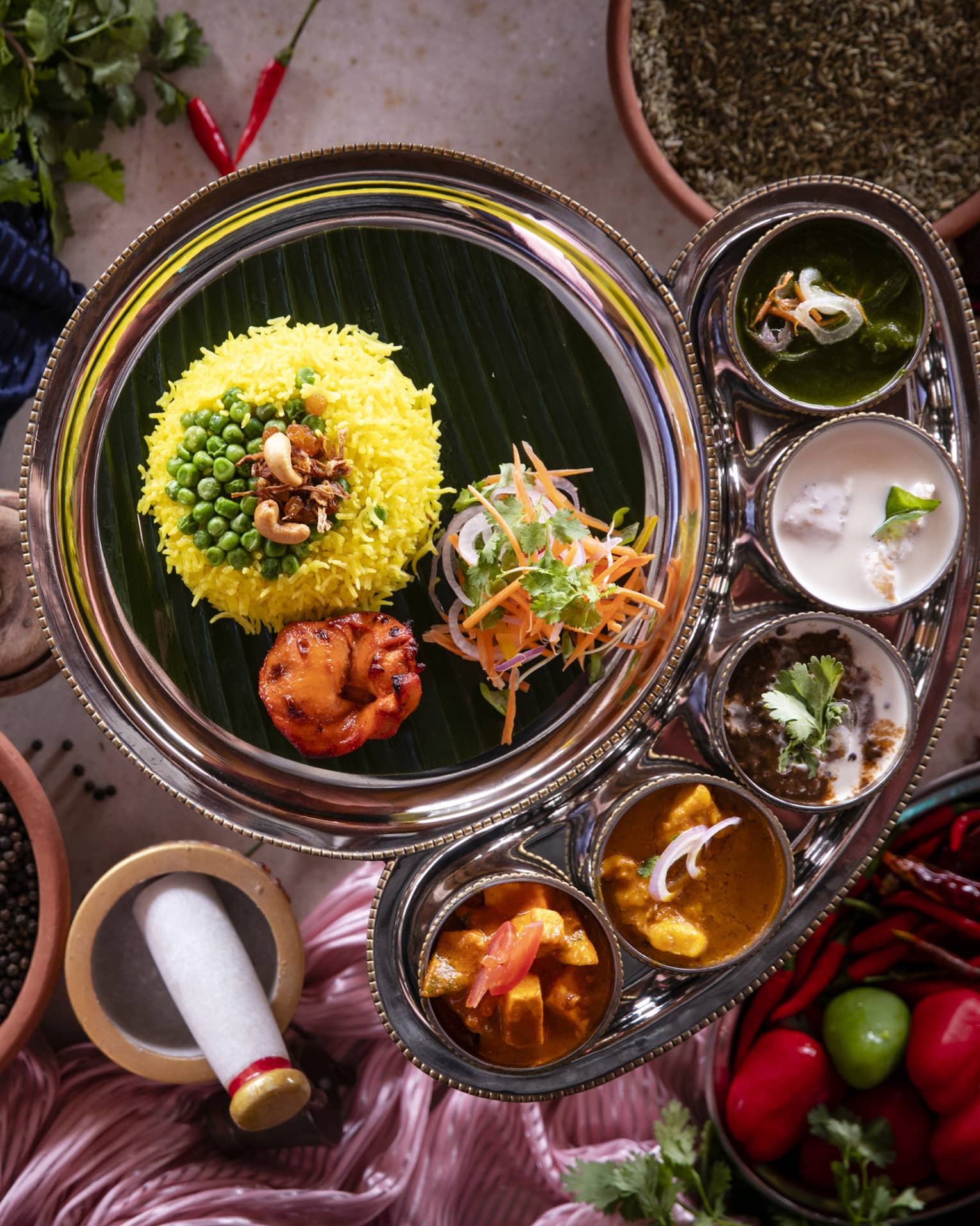 An aerial view of an assortment of Indian food at Baraabaru Indian Thali