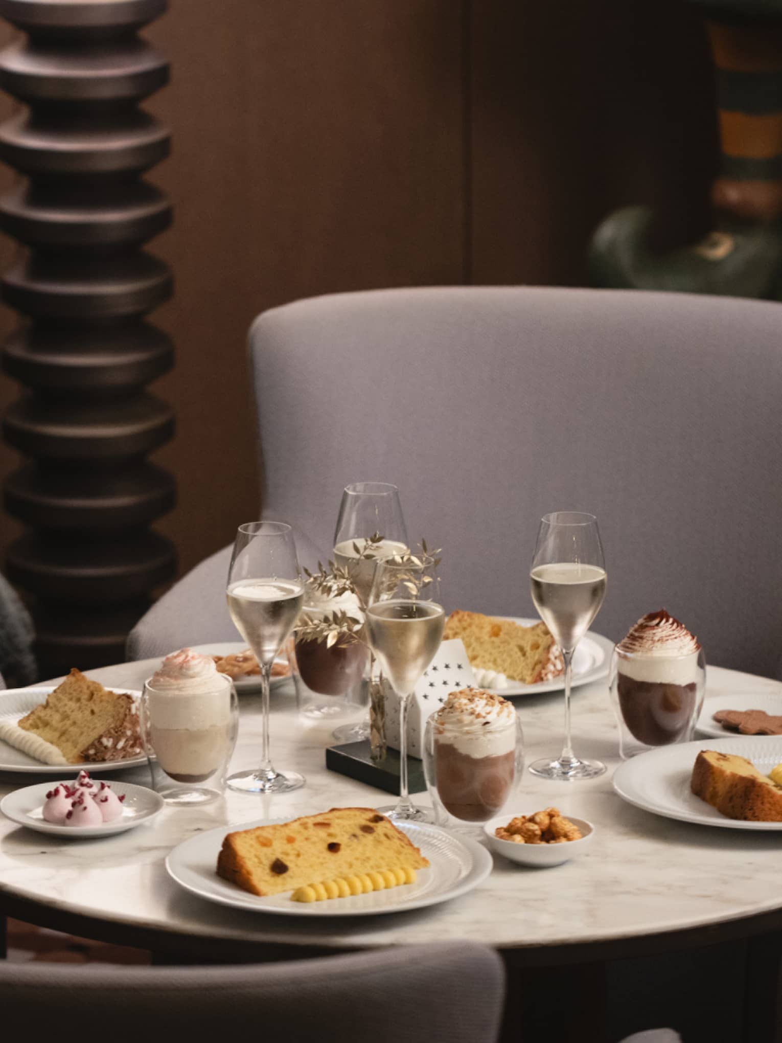 A dining table set with festive food items and beverages