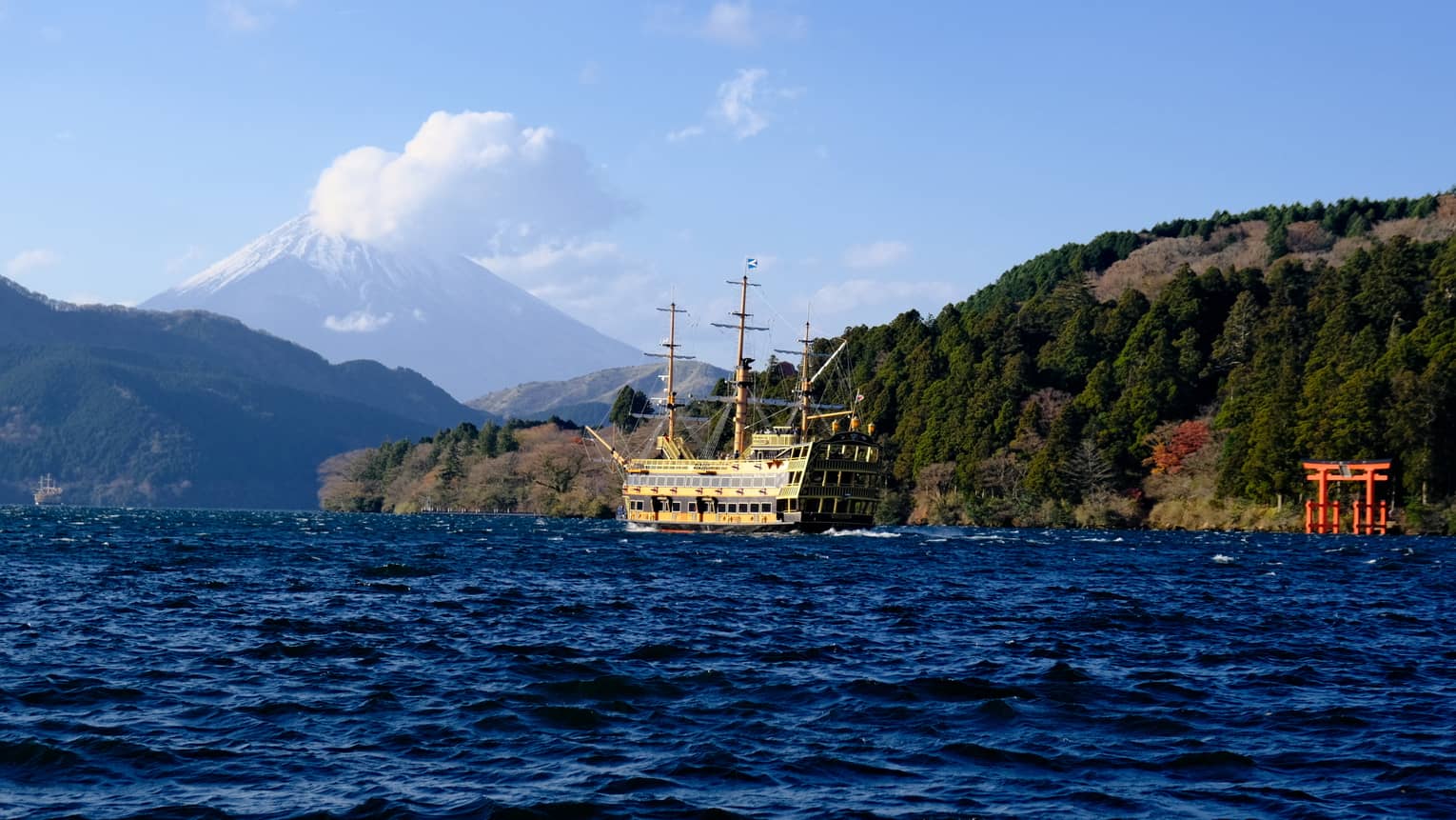 Mt Fuji lake view with a sightseeing boat and view of Hakone Shrine