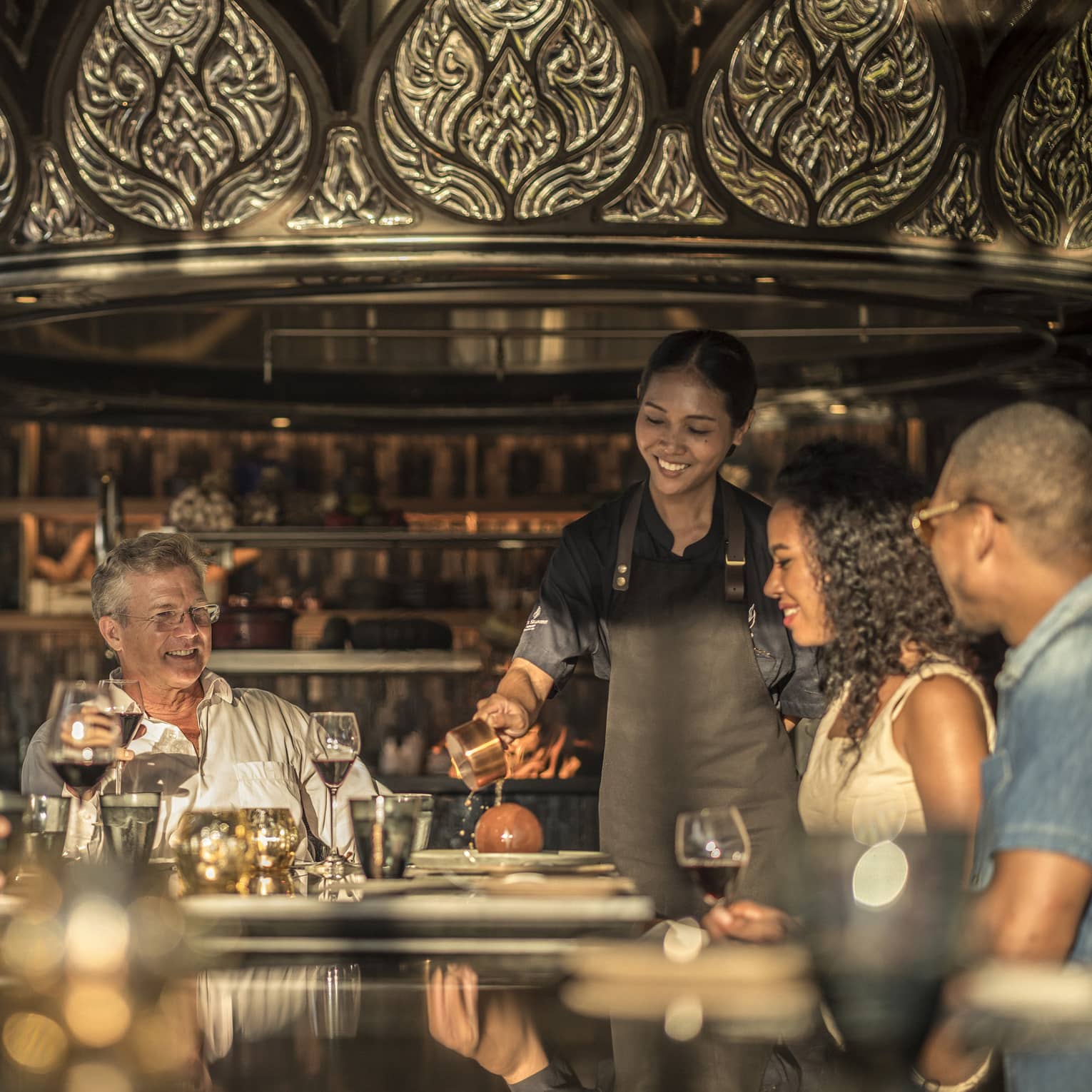 Family gathered around a restaurant table, celebrating a holiday dinner together
