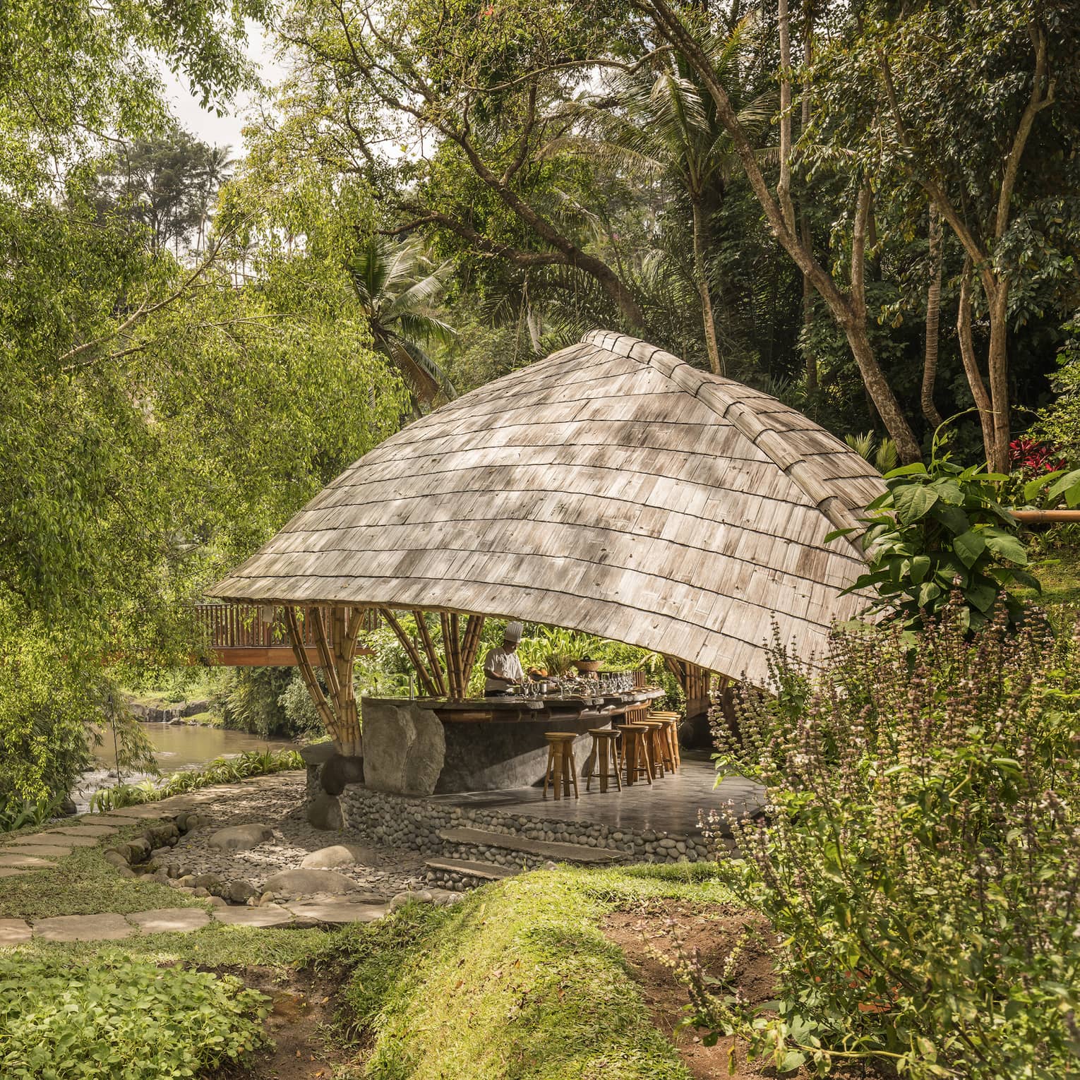 Four Seasons guests attend Sokasi Cooking School in an outdoor pavillion