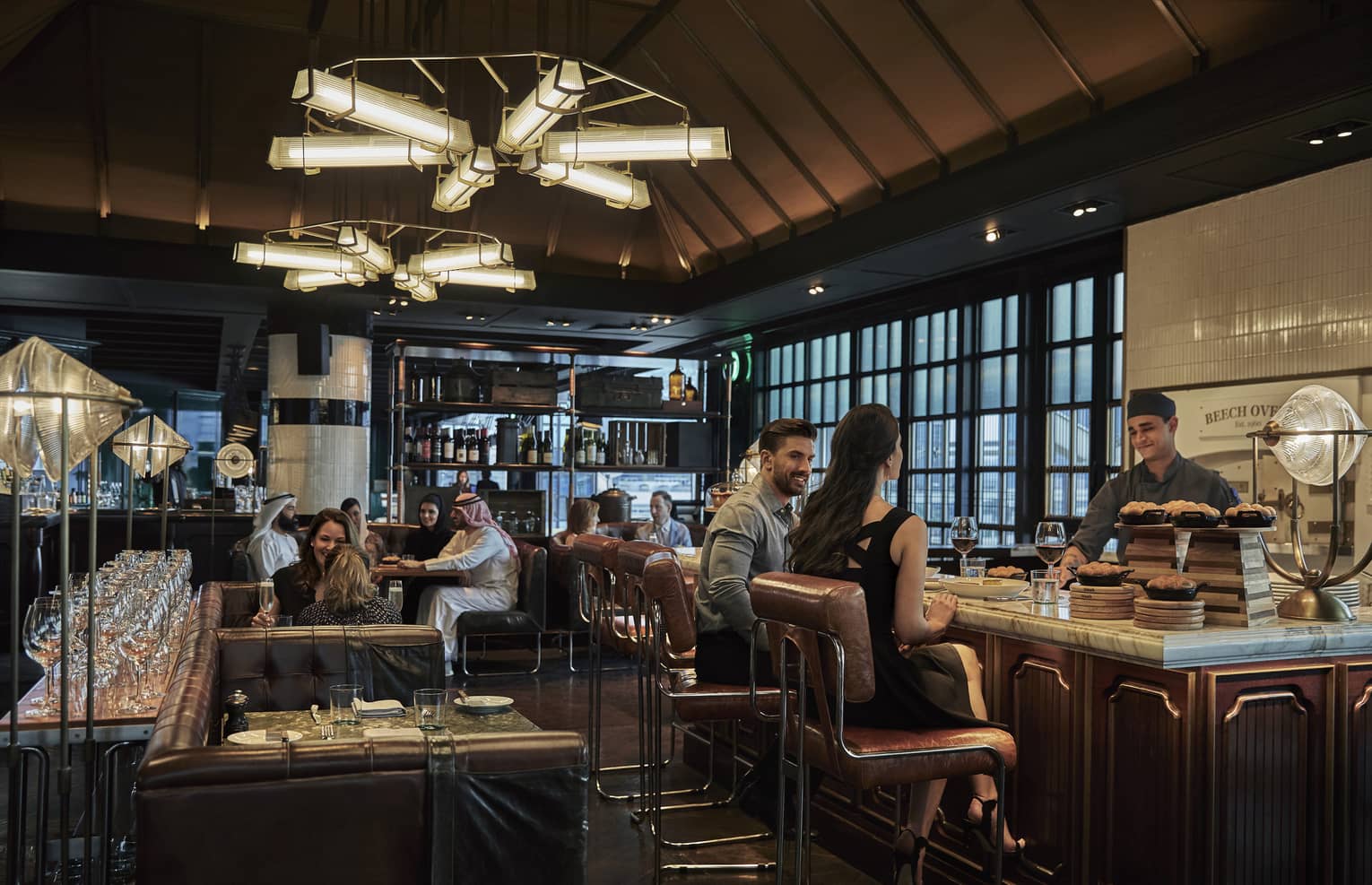 Various couples dine at Butcher & Still in the evening