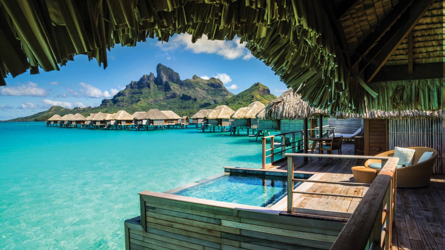 Bora Vacation Resort 5 Star Four Seasons View From Under Thatched Roof Of Poerava Overwater Bungalow Suite With Plunge Pool Over Lagoon