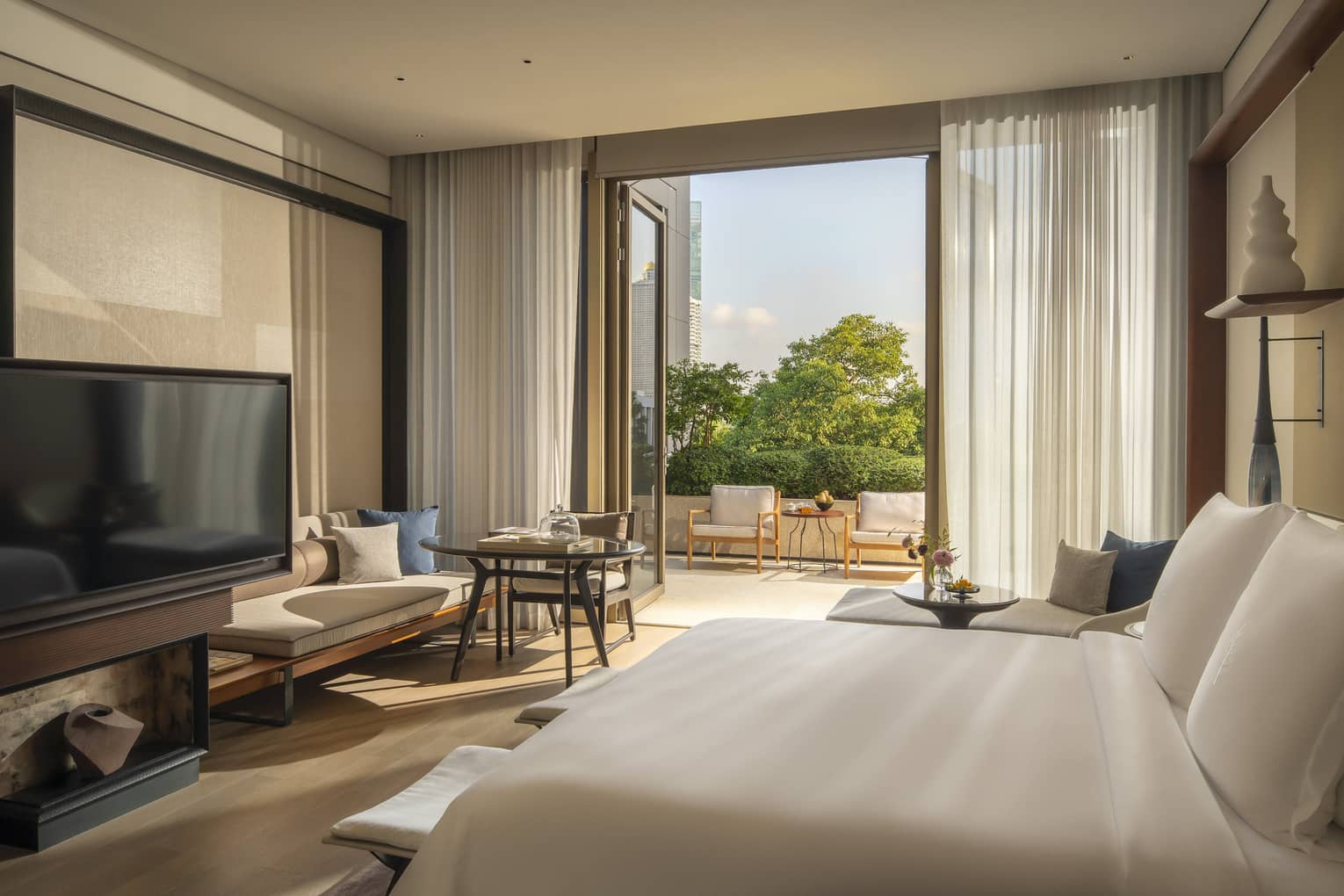 Luxury hotel room with balcony at Four Seasons Hotel Bangkok