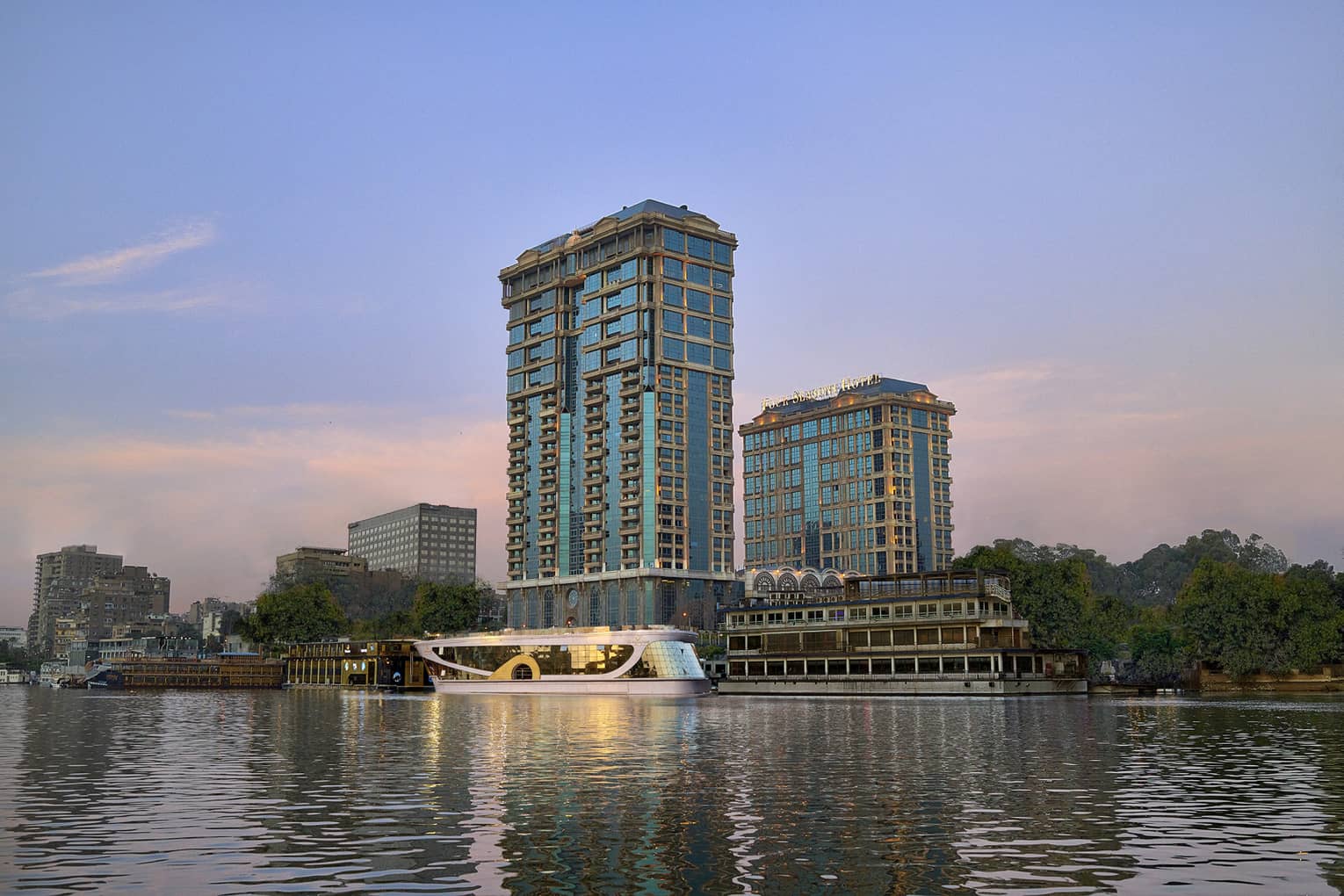 Cairo at the First Residence exterior illuminated at sunset