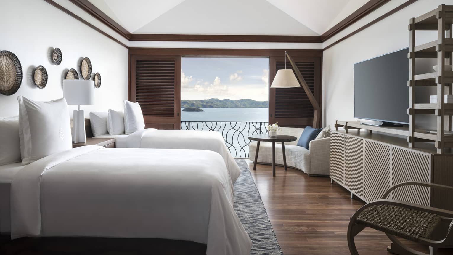 Two-Bedroom Residence Villa with Plunge Pool side view of twin beds in front of open wood shutters to patio