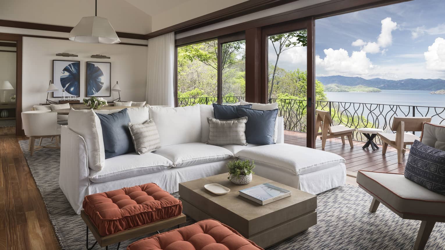 Three-Bedroom Residence Villa with Plunge Pool living room with white L-shaped sofa, ottomans by open patio door