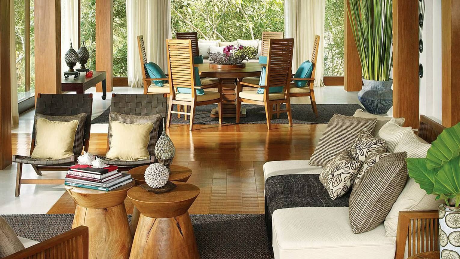 Four-Bedroom Residence Villa with Pool living room with sofa, wood chairs and tables, colourful pillows