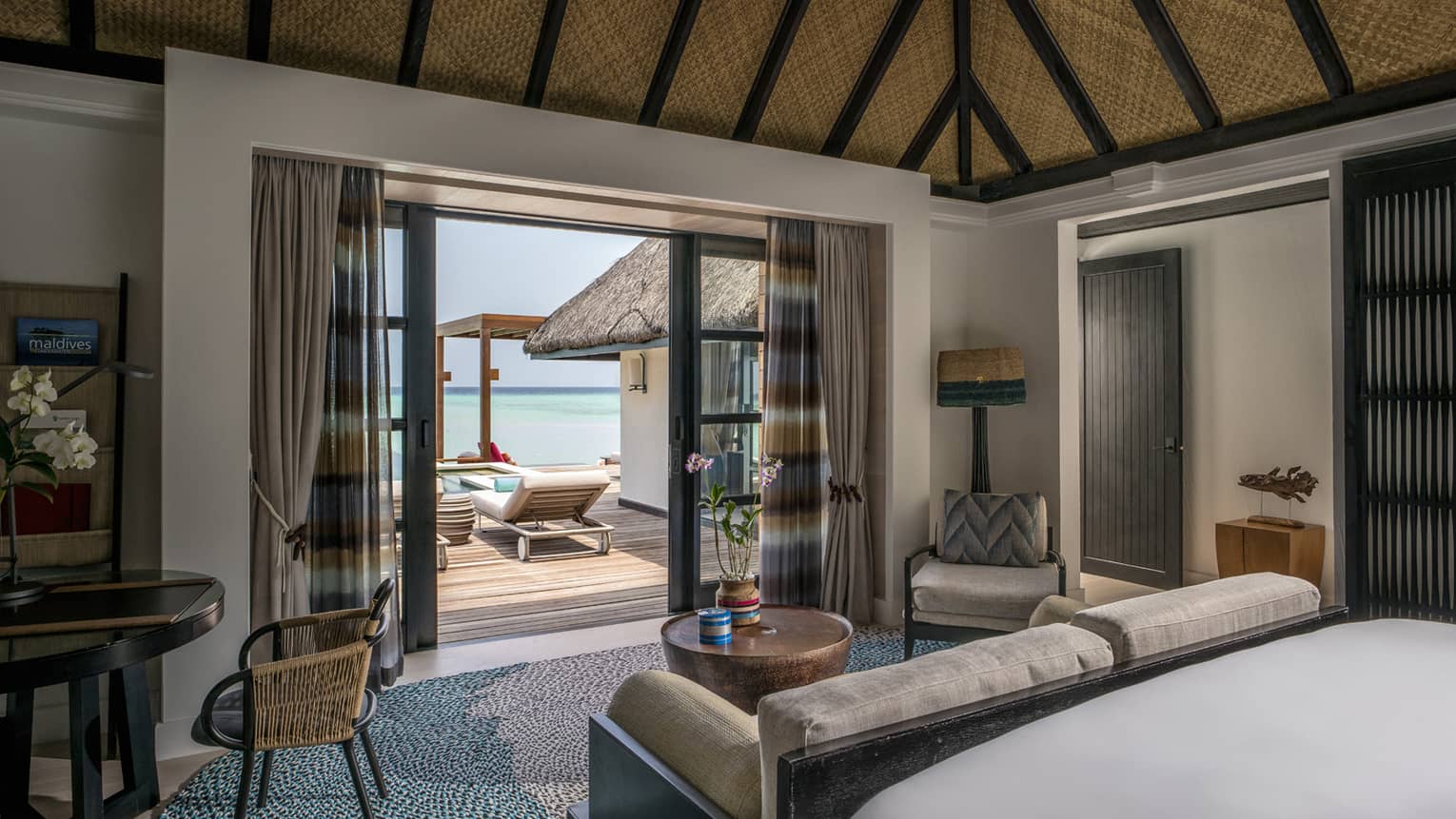 Sun loungers visible from inside the two-bedroom water suite