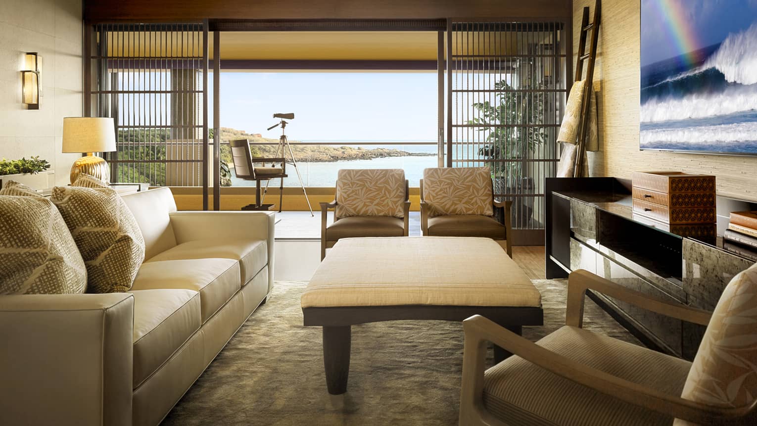 Alii Suite sitting room by large open wall to patio