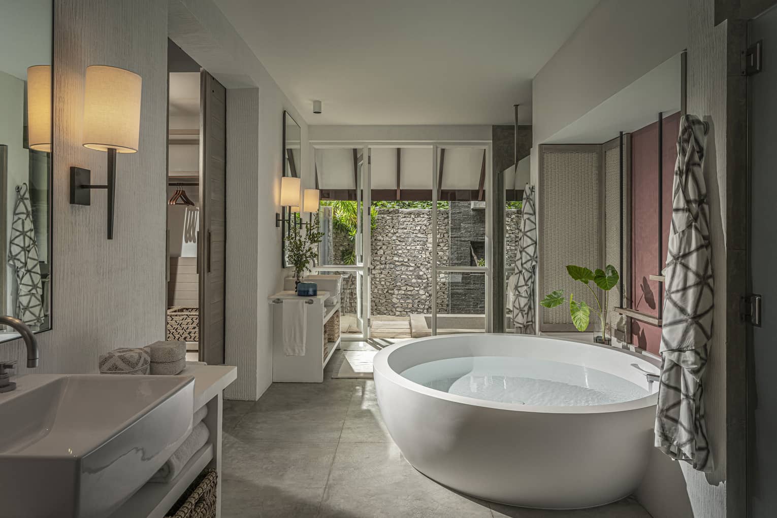 Beach Villa with Pool bathroom with large soaking tub, vanity, door to terrace