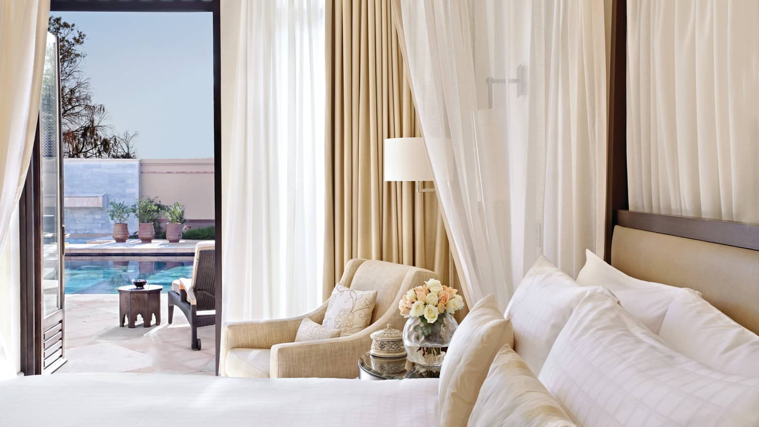 Four-Bedroom Royal Villa with Private Pool, bedm white curtains and armchair beside open balcony door to patio