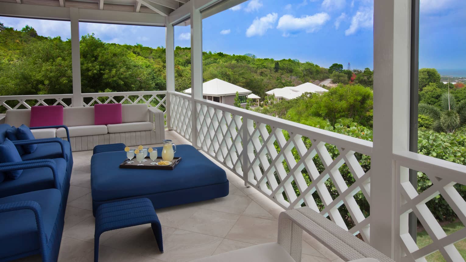 Dark blue patio furniture on balcony with decorative railings