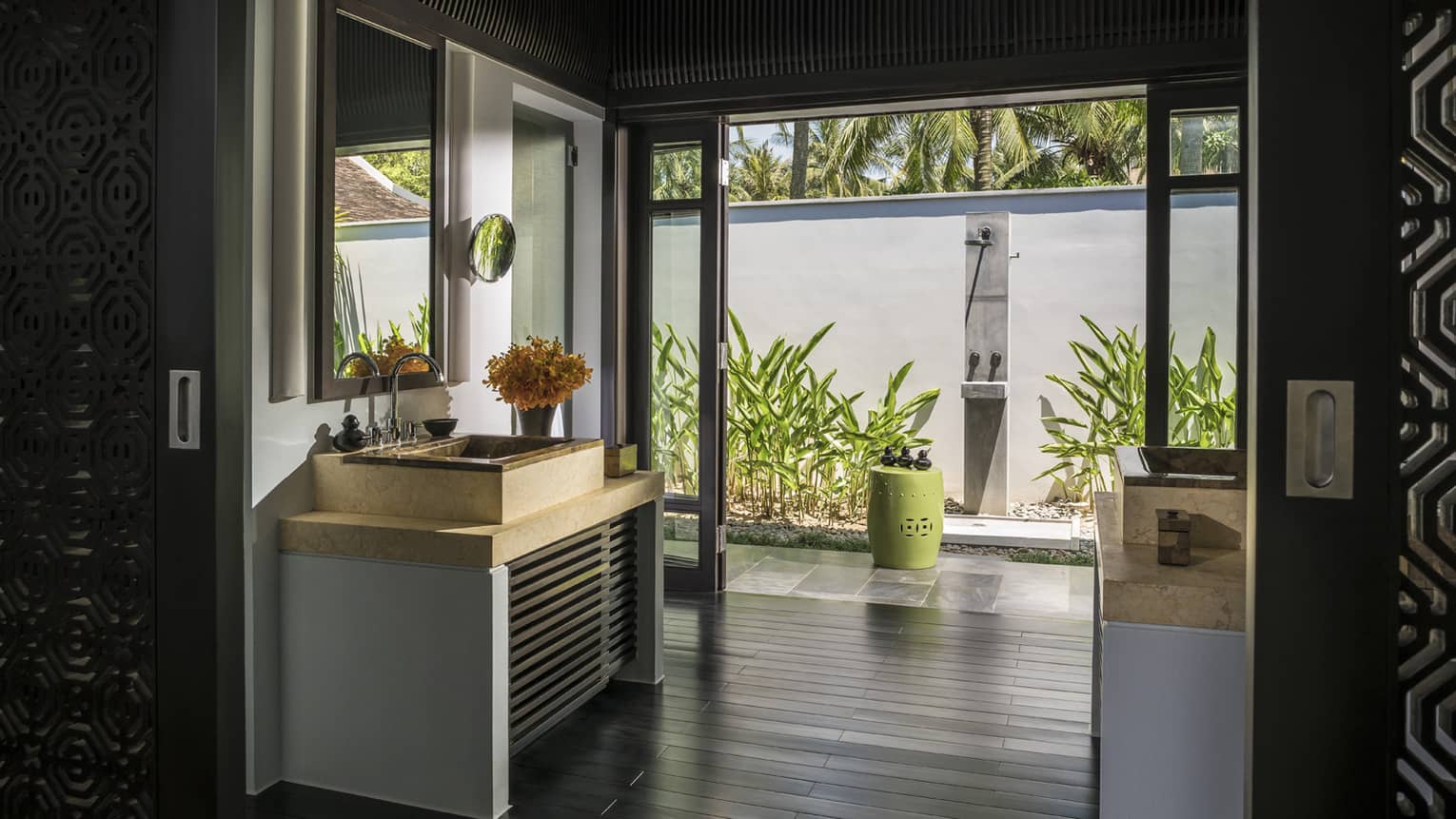 Sink, vanity in large bathroom with open wall to al fresco shower 