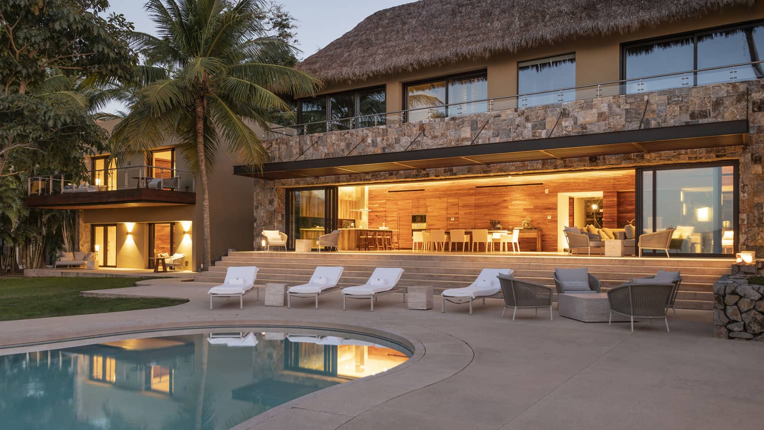 Private residence, Casa Vista, at Four Seasons Resort Tamarindo, illuminated pool deck at night