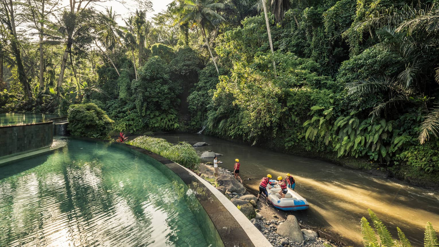 An aerial view of four seasons guests arriving to the sister Bali Resort in a raft \