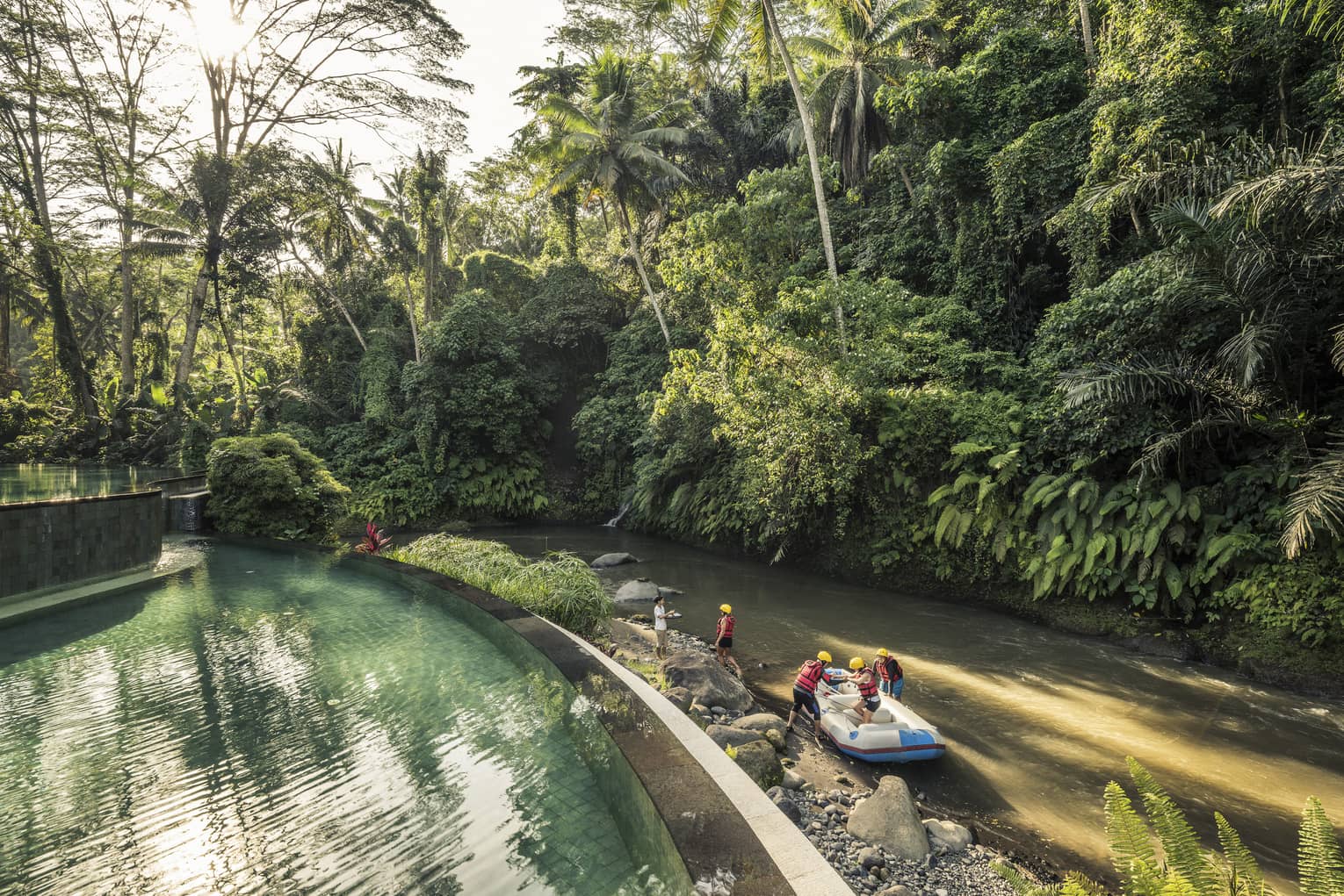 An aerial view of four seasons guests arriving to the sister Bali Resort in a raft \