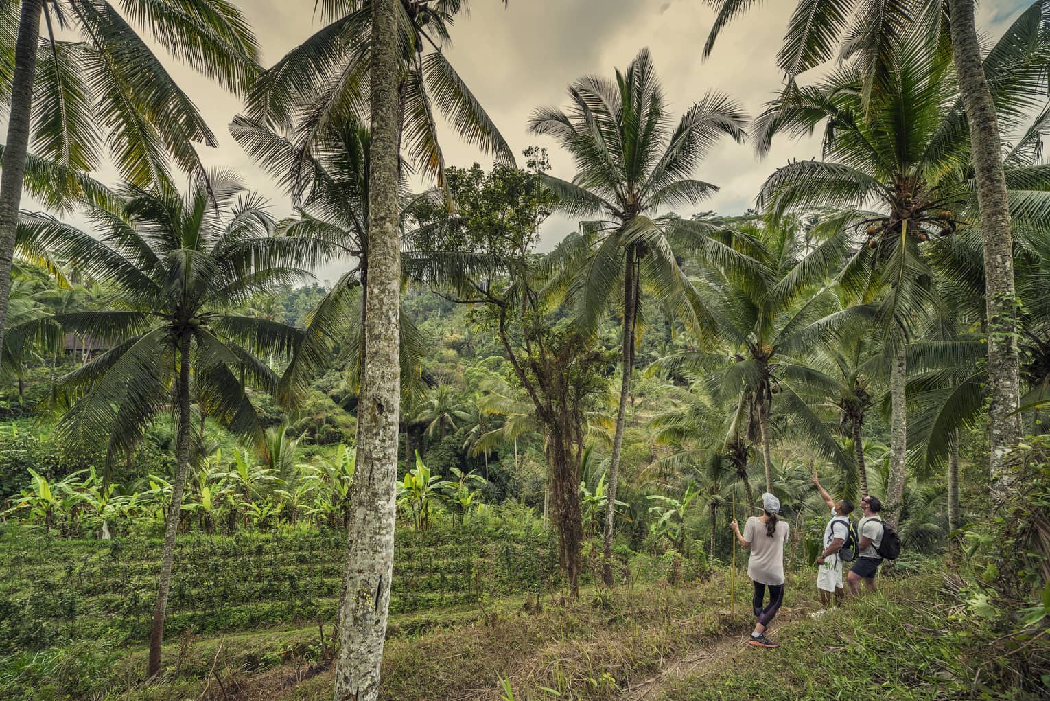 Four Seasons guests explore the village near four seasons hotel bali at sayan