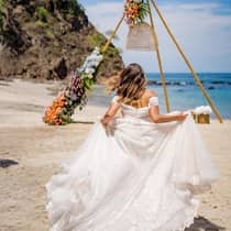 Bride running on the beach 