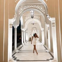 Lady in middle of Dubai resort hallway,lady in middle of dubai resort hallway