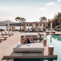 Four Seasons Athens Pool and Private Bed with the beach in the background