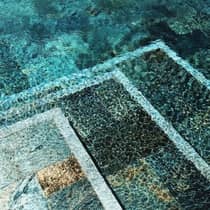 Artistic photo of tiles under blue water