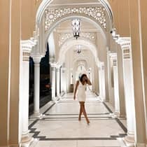 Lady in middle of Dubai resort hallway,lady in middle of dubai resort hallway