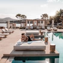 Four Seasons Athens Pool and Private Bed with the beach in the background